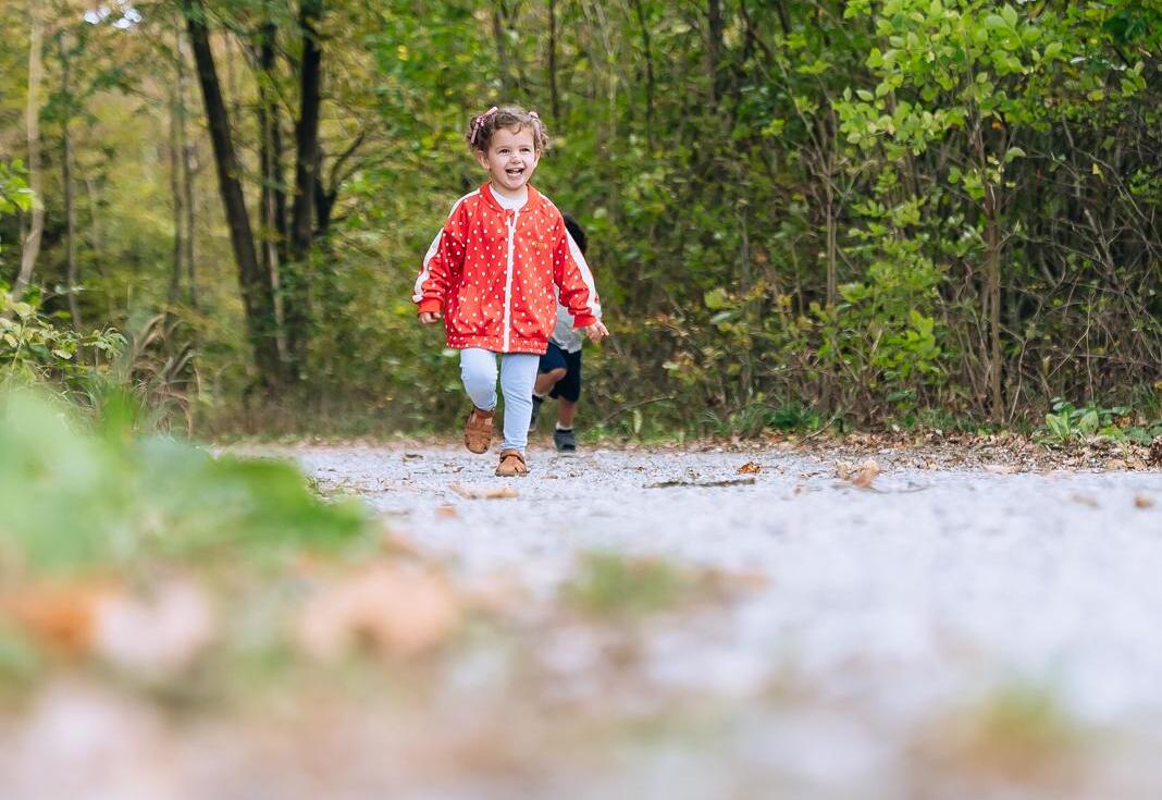 Children sitting together on a bench at Big Little Moments